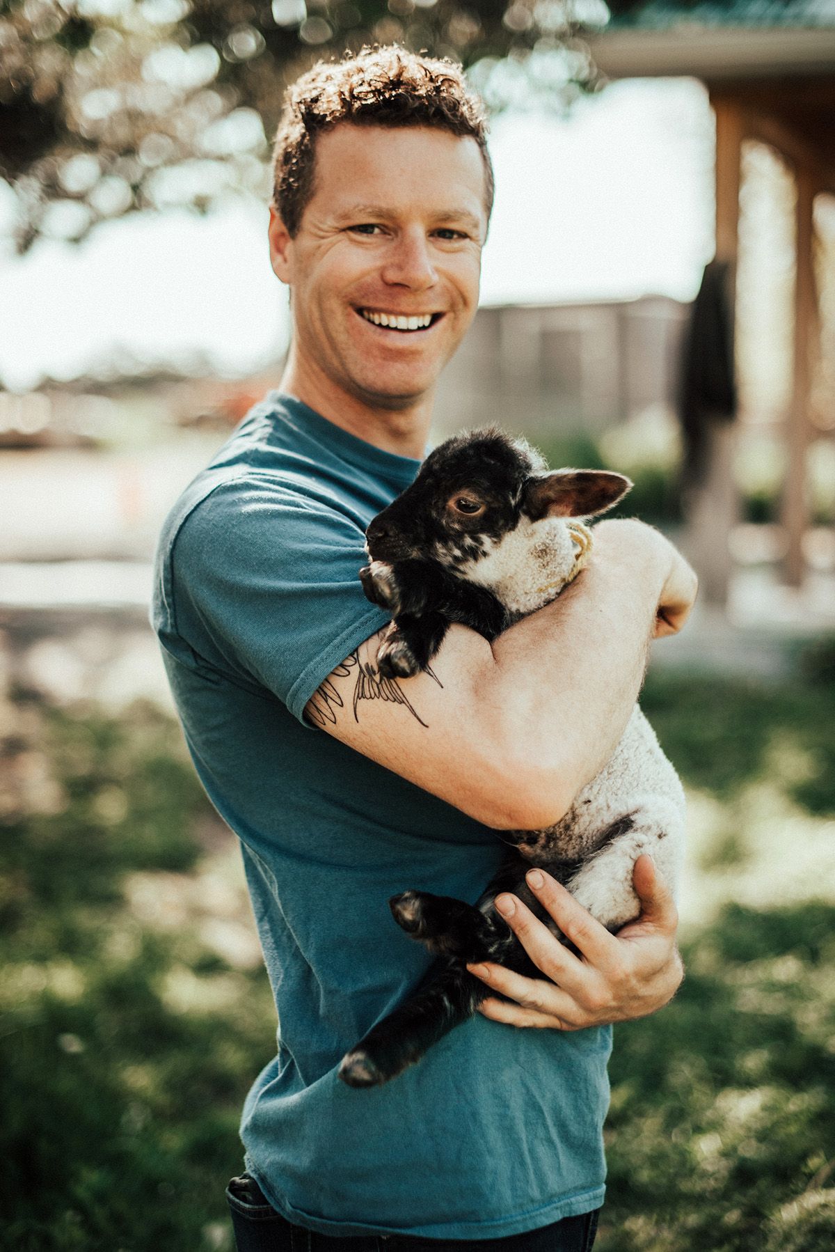 Jacob Murray of Topsy Farms holding a lamb