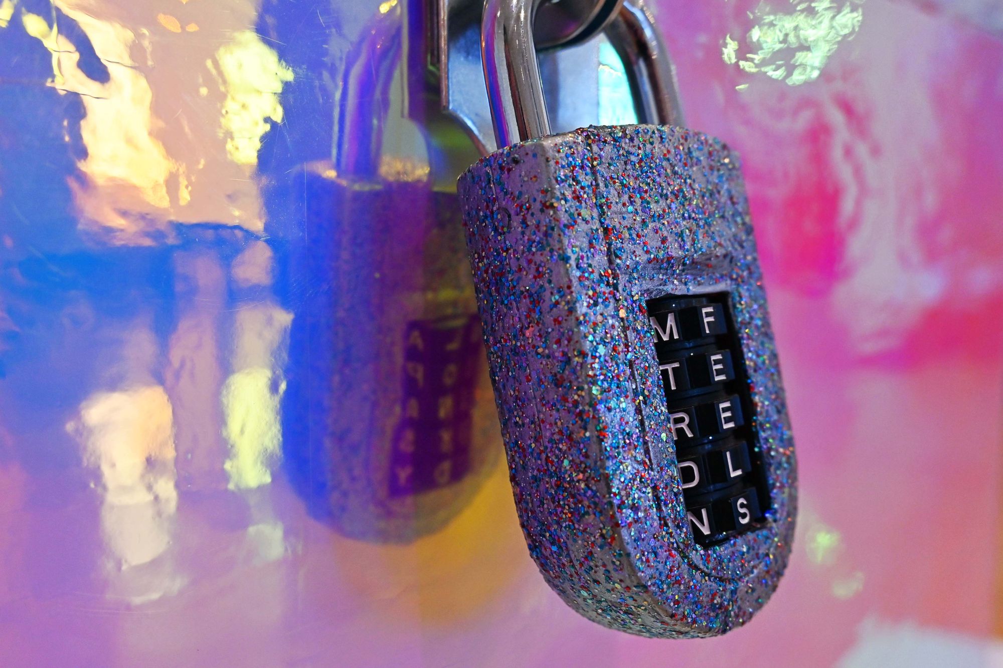 Close-up of a multicoloured lock on a glossy box