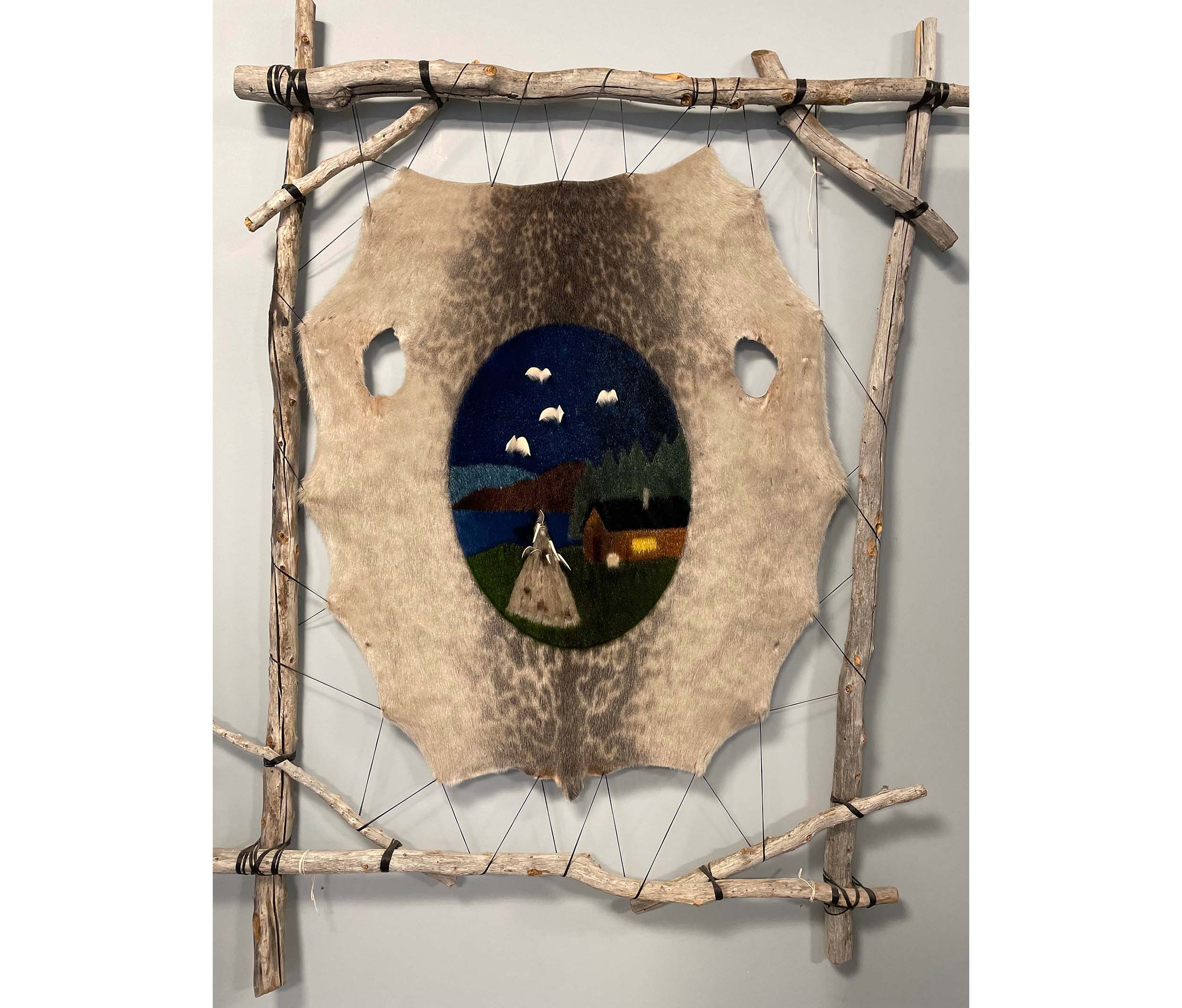 A piece of art on sealskin, stretched in a wooden frame