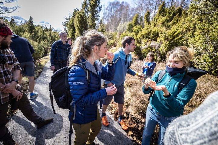 A group of people on a trail outdoors